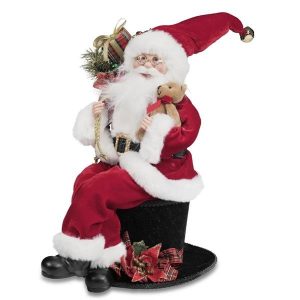 Babbo natale suduto sul cappello
